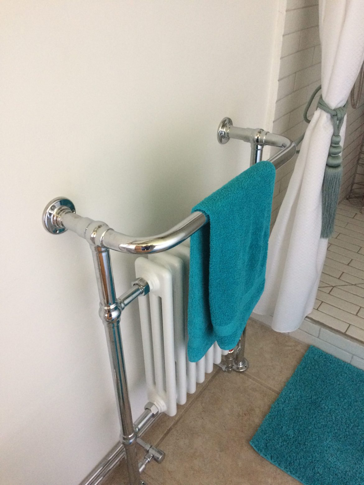 New heated towel rail installation by Abode, the home of renewable heat